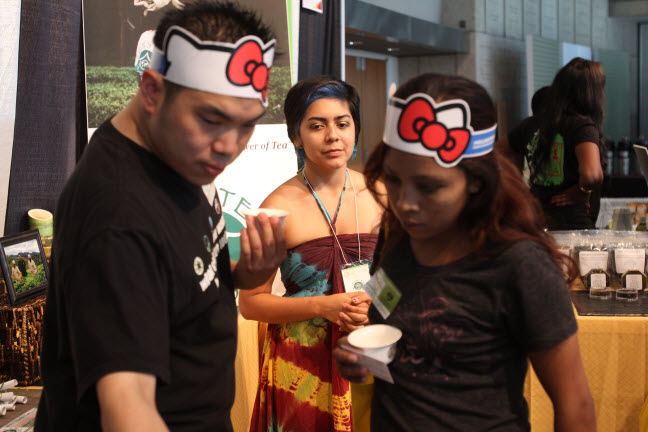 Zen Tea House staff assists attendees at their booth.