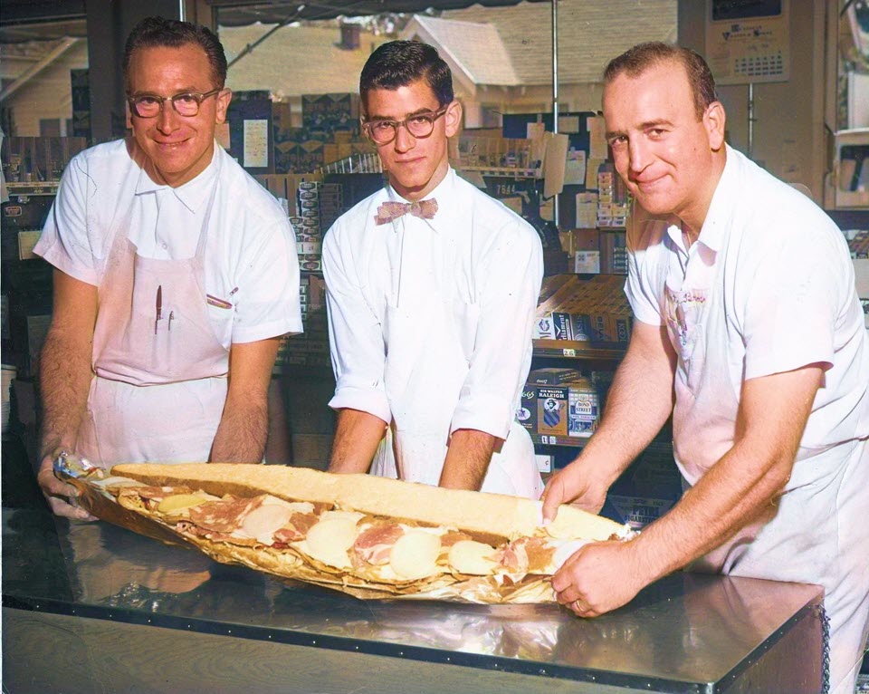 Gino, Darrell, and Frank Corti make a memorable all-meat and cheese sandwich at Corti Bros. Gourmet Food and Wine. The photo was taken in 1959 or 1960 at the 32nd & Folsom Blvd location in Sacramento. Corti Bros. was founded in 1947 and helped spark California’s gourmet food revolution. Courtesy Rick Mindermann, Corti Bros.